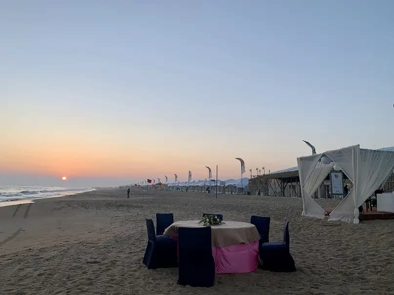 Eco Retreat Konark beachfront dining and tent row at sunrise