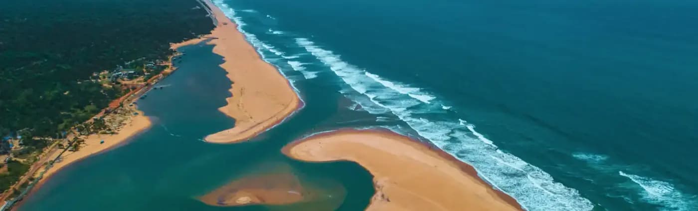 Aerial Kushabhadra river–Bay of Bengal confluence at Ramachandi Beach
