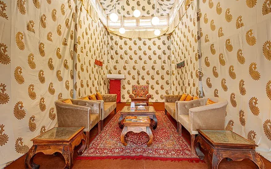Lounge with two facing sofas and coffee table at Rann Utsav — reference